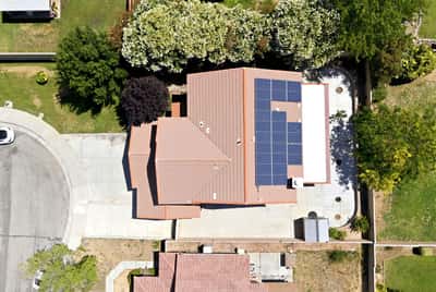 This spacious home features solar panels, expansive outdoor space, and convenient access to local amenities.