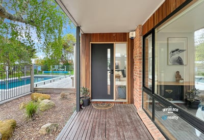 Discover modern living with a seamless indoor-outdoor flow, featuring a sleek entry and inviting surroundings.