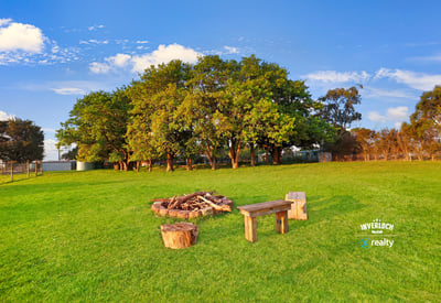 Expansive outdoor space featuring a cozy fire pit area, perfect for gatherings and relaxation.
