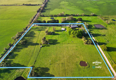 Spacious rural property featuring vast grassy fields, multiple water features, and expansive potential for development.