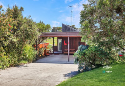 Discover this unique home surrounded by vibrant greenery, offering a seamless blend of indoor and outdoor living.