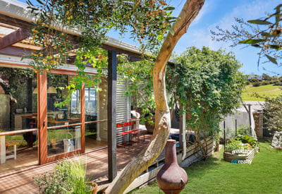 Bright and inviting home featuring expansive outdoor space and modern design, perfect for relaxed living.