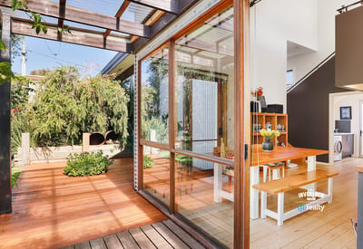 Bright and inviting indoor-outdoor space featuring natural light and a spacious dining area.