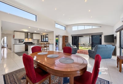 Bright, open-concept living area featuring spacious dining and a modern kitchen, perfect for entertaining.