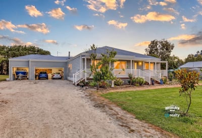 This inviting home features spacious gardens, ample parking, and a welcoming front porch in a peaceful setting.