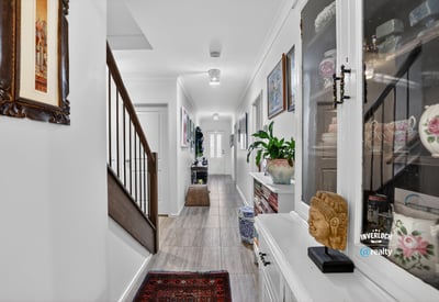 Discover a modern hallway featuring natural light, tasteful decor, and a welcoming ambiance throughout.