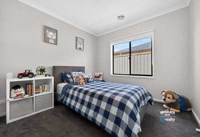 Bright, inviting bedroom featuring cozy decor, natural light, and ample space for personal touches.