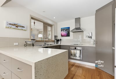 Modern kitchen featuring sleek cabinetry, ample counter space, and a seamless blend of functionality and design.