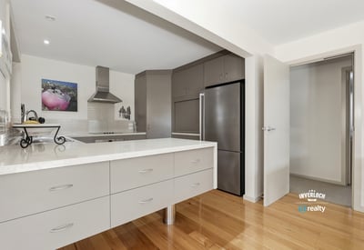 Modern kitchen features sleek cabinetry and a functional layout, perfect for culinary enthusiasts and entertaining.
