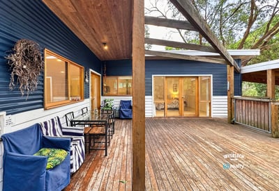 Spacious outdoor deck offers seamless indoor-outdoor living, perfect for entertaining amid a tranquil natural setting.