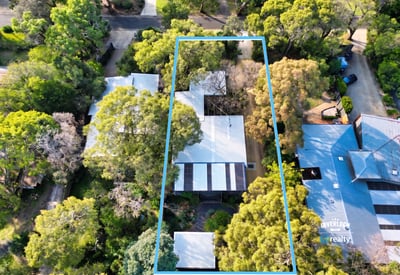 Spacious property surrounded by lush greenery, perfect for those seeking tranquility and ample outdoor space.