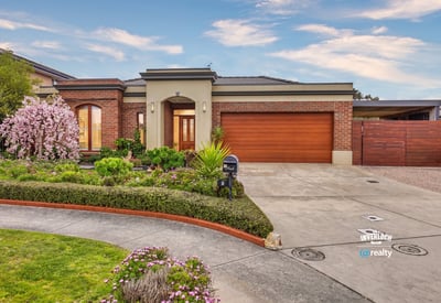 Discover this inviting home featuring lush landscaping, a spacious driveway, and ample natural light throughout.