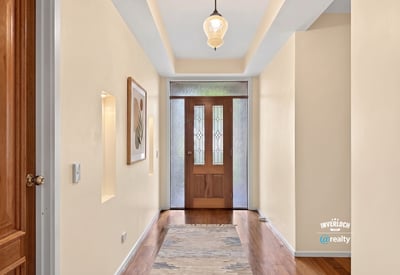 Inviting foyer with natural light, showcasing a welcoming entry that leads to the main living spaces.