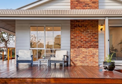 Relax on the spacious deck, featuring inviting seating and a blend of modern and classic design.