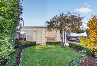 This modern property features a landscaped garden and inviting outdoor space perfect for relaxation and entertainment.