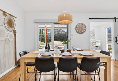 Bright dining area featuring natural wood accents, perfect for gatherings and everyday meals with family.