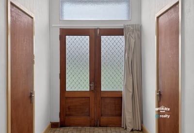 Bright entryway featuring distinctive glass doors and abundant natural light, welcoming you into the home.