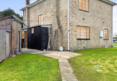 This spacious property features ample outdoor space and a versatile layout for various living options.