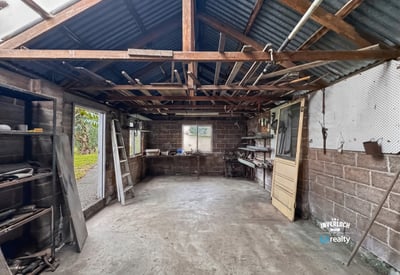 Spacious workshop with open layout, ample natural light, and potential for customization to suit your needs.