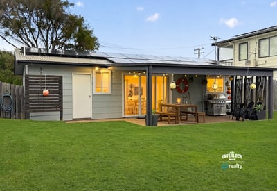This modern home features a spacious yard, inviting patio area, and ample natural light throughout.