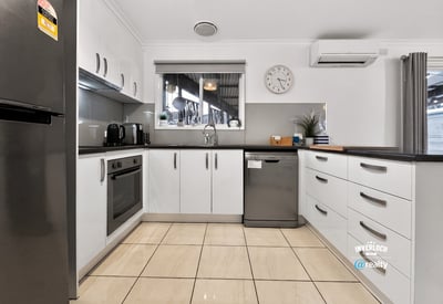 Modern kitchen featuring ample storage, stainless steel appliances, and a spacious layout for culinary creativity.