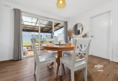 Bright dining area with outdoor access, perfect for enjoying meals and entertaining in a spacious layout.