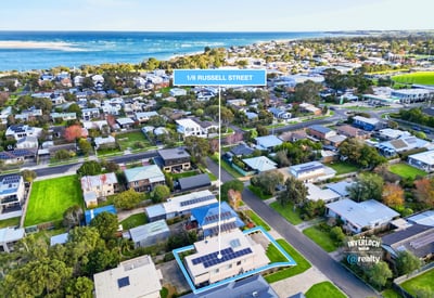 Discover this coastal property with modern features and ample outdoor space, perfect for beachside living.