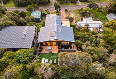 Discover a unique retreat surrounded by lush greenery, offering modern comforts and outdoor living space.
