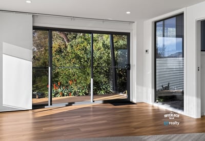 Bright and airy living space with large windows that offer stunning views of the outdoors.