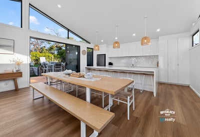 Bright and spacious kitchen features modern amenities, abundant natural light, and an inviting dining area.