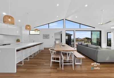 Spacious open-concept living area with modern finishes and abundant natural light, perfect for entertaining.