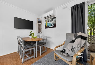 Bright and airy living space featuring a cozy dining area and modern amenities for comfortable living.