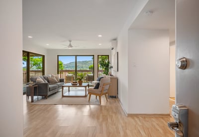 Spacious living area with large windows provides breathtaking views and seamless indoor-outdoor living experience.