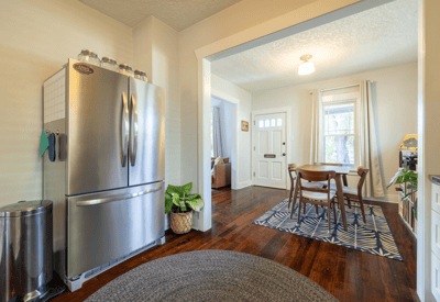 Bright and inviting kitchen flows seamlessly into a cozy dining area, ideal for gatherings and daily meals.