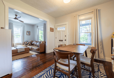Bright and inviting open layout featuring a cozy living area and dining space, perfect for gatherings.