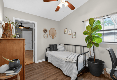 Bright and inviting bedroom featuring a cozy layout, and ample natural light.