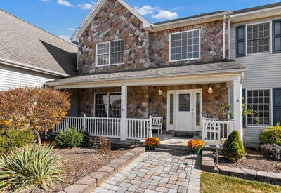 Stone accents, professional landscaping, classic front porch. Enjoy amazing sunset views!