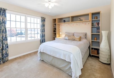 Bedroom 4 is a bright room with backyard view, fan/light, and closet.