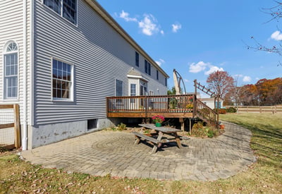 The large paver patio and deck provide lots of room for entertaining and outdoor recreation.