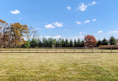 This vast, perfectly level fenced area is perfect for play, pets, or a future pool and garden.