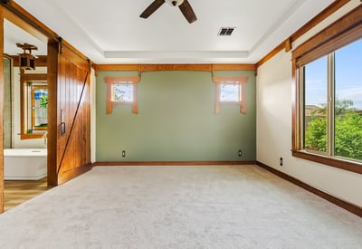 Spacious primary suite offering abundant light, soft carpeting, and calming views. Designed as a private retreat within this beautifully finished Phoenix property.