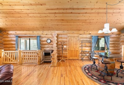 Dining area with bar seating, wood accents, and open sightlines ideal for hosting guests and enjoying everyday meals.