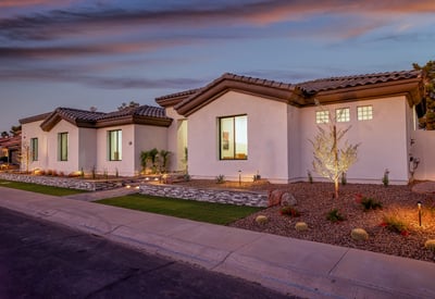 Twilight lighting enhances the architectural details and landscaping, giving this Scottsdale home standout curb appeal.