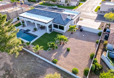 A wide lot with pool, covered patio, and low-maintenance landscaping offers the perfect Scottsdale outdoor retreat.