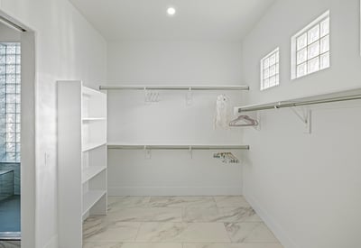 Oversized closet with built-in shelving and storage maximizes organization in the Scottsdale main suite.