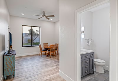 A private bedroom with en-suite bath provides comfort and independence for guests or family members.