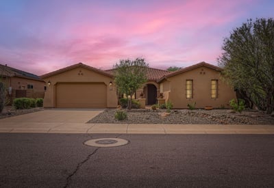 This Peoria property shines beneath Arizona s colorful evening skies. Desert landscaping and timeless curb appeal create a welcoming first impression.