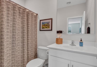 Featuring fresh cabinetry, modern fixtures, and a full tub/shower, this guest bathroom enhances the home s updated appeal. A clean, functional space within this Litchfield Park property.