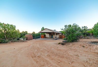 Ample outdoor space surrounds the home, offering room for parking, equipment, or future enhancements while enjoying a peaceful Hackberry landscape.