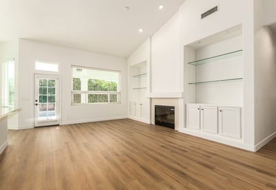 Comfortable family room with a stylish fireplace and built-in shelving accents. This inviting Scottsdale space is perfect for relaxing evenings or entertaining guests in a warm, welcoming setting.